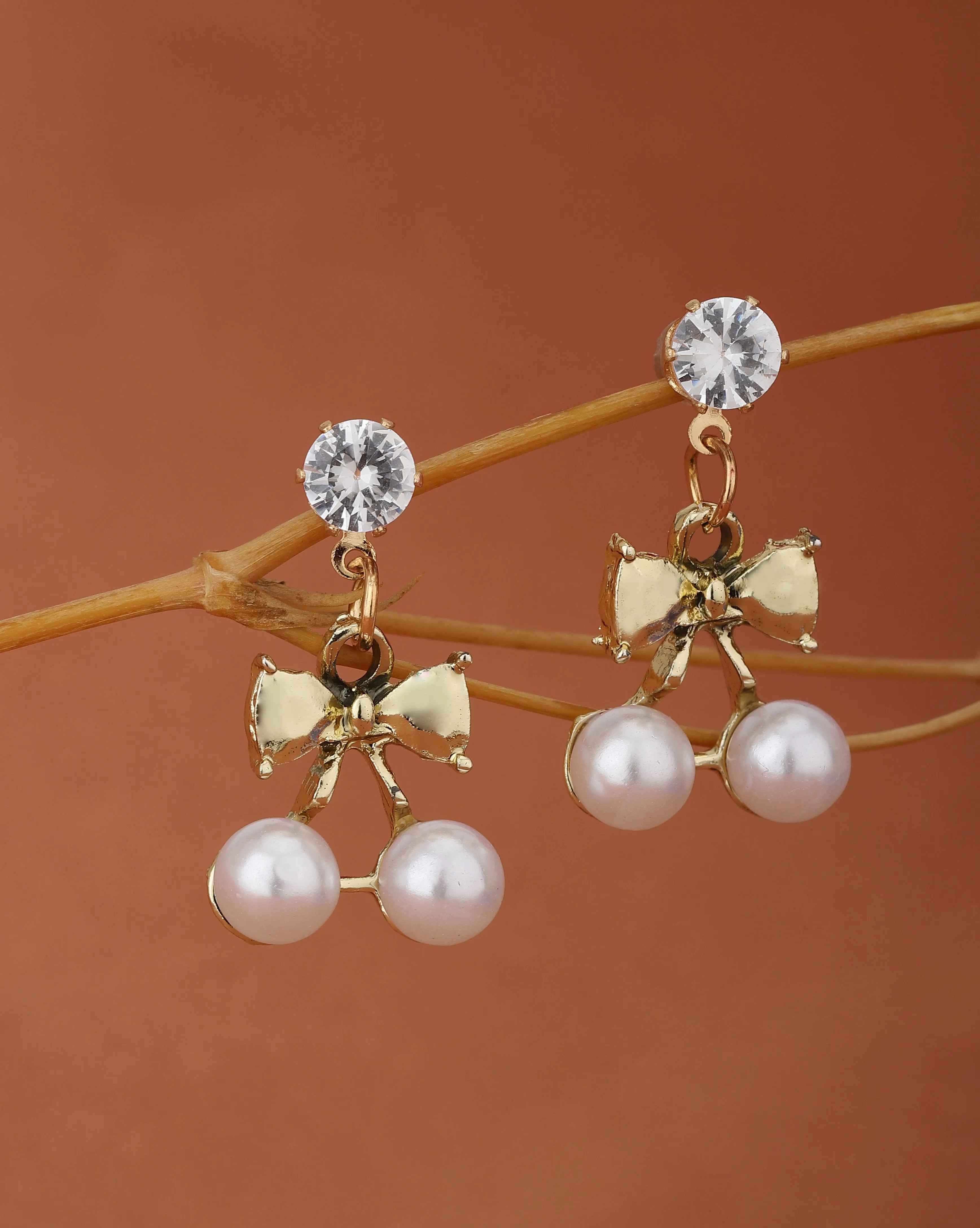 Carlton London Gold Plated Cz White Pearl Bow Drop Earring For Women